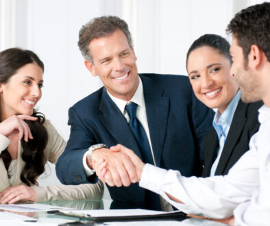 Group of professionals shaking hands.