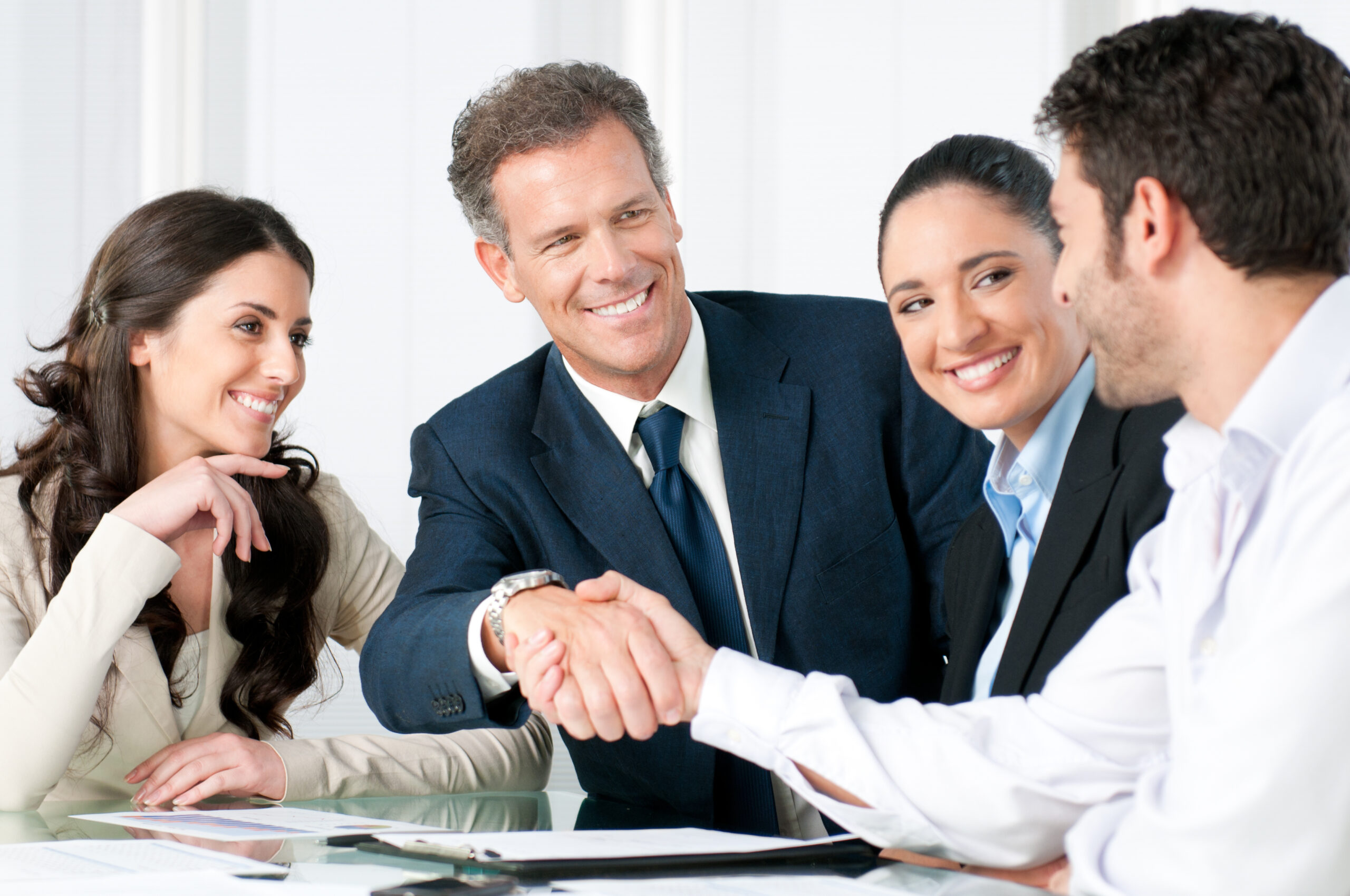 Business handshake to seal a deal Group of professionals shaking hands.