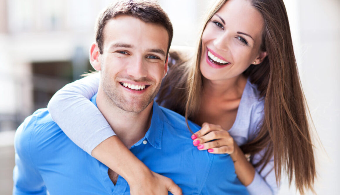 Happy young couple who are excited about the possibility of exam and lab-free life insurance applications.