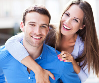 Happy young couple who are excited about the possibility of exam and lab-free life insurance applications.