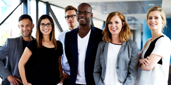 Group of young happy mixed race professional men and women