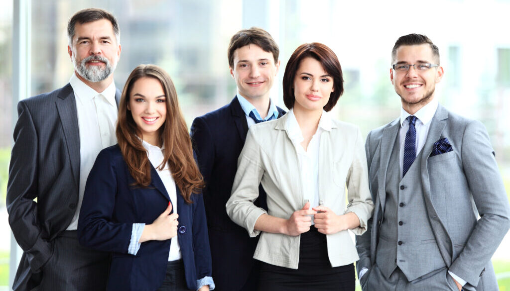 Happy young professionals smiling who just had a webinar called optimizing your LinkedIn experience section