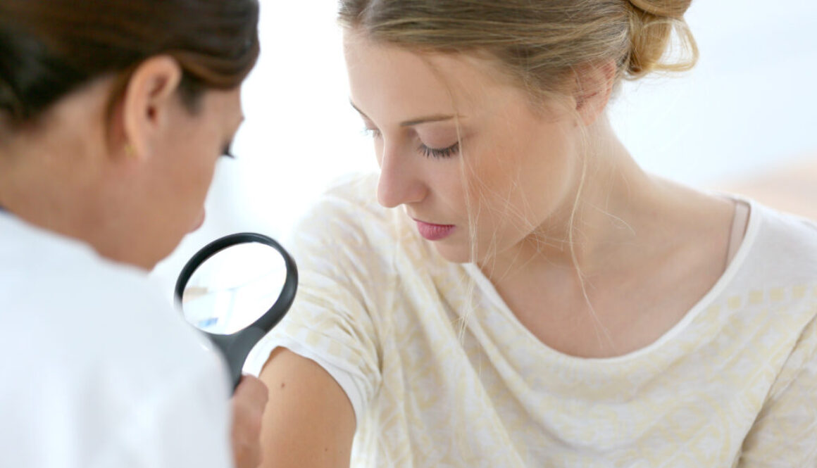 Young woman seeing doctor for dermatological control skin cancer Skin cancer checkup