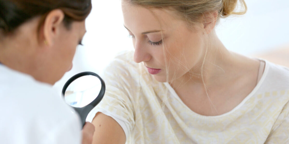 Young woman seeing doctor for dermatological control skin cancer Skin cancer checkup
