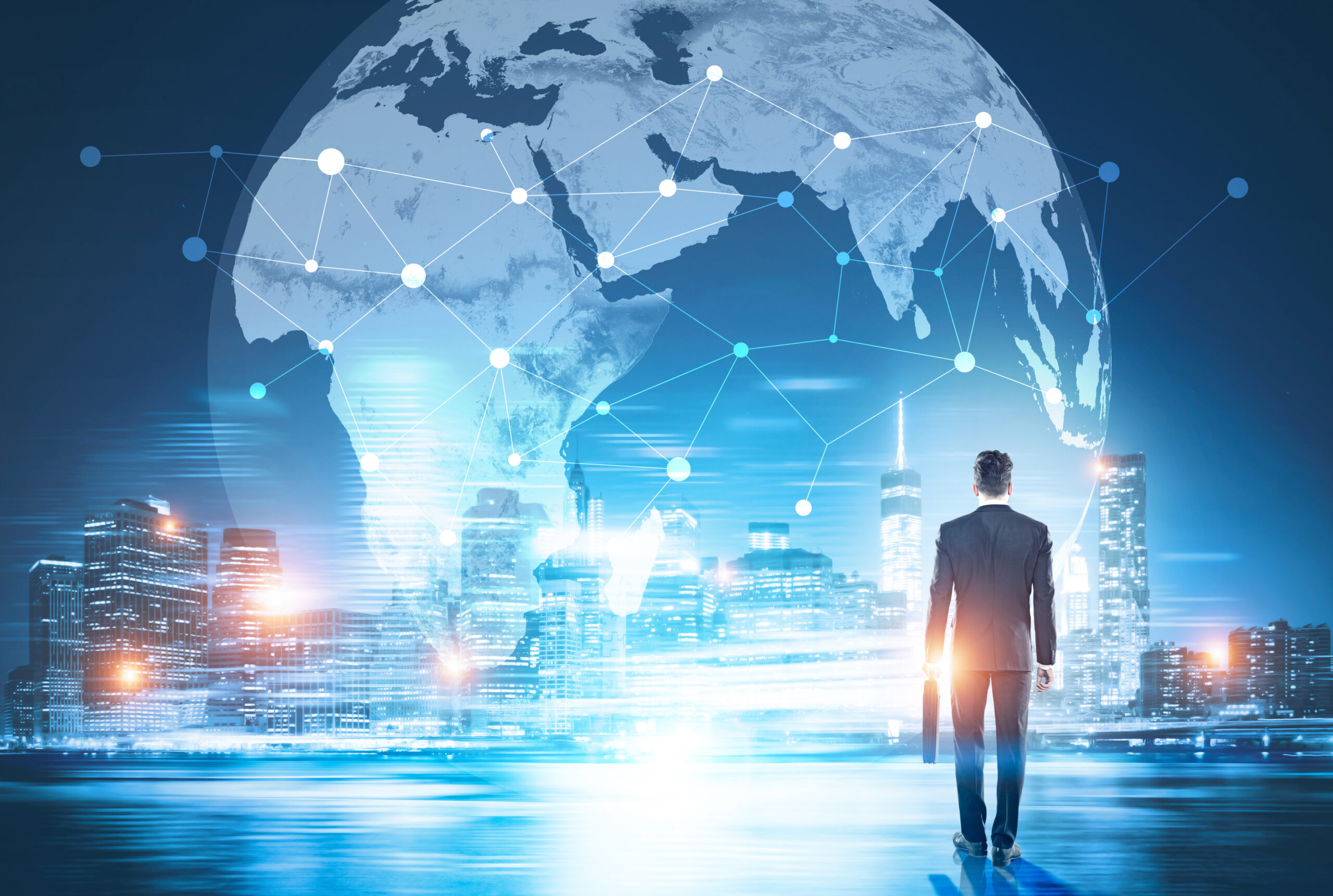 Global networking and business International Travelers looking at an image of the blobe