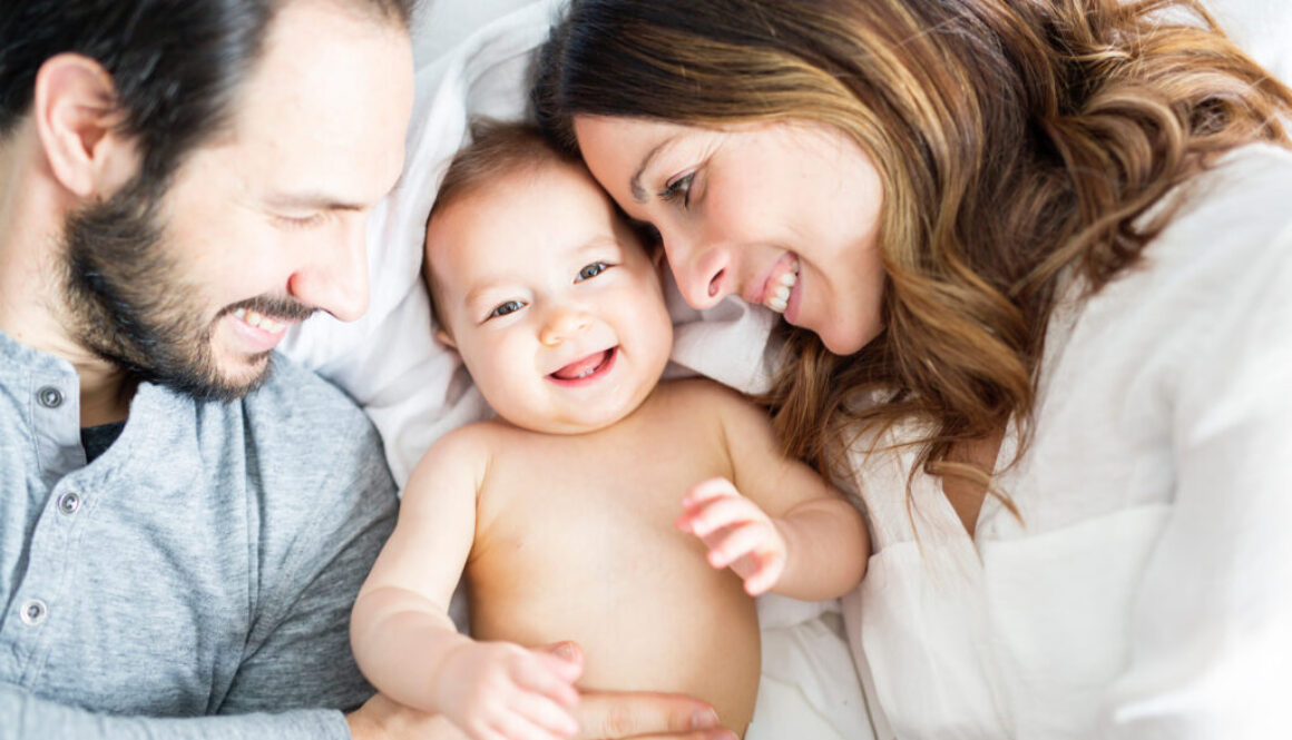 Young happy couple with baby