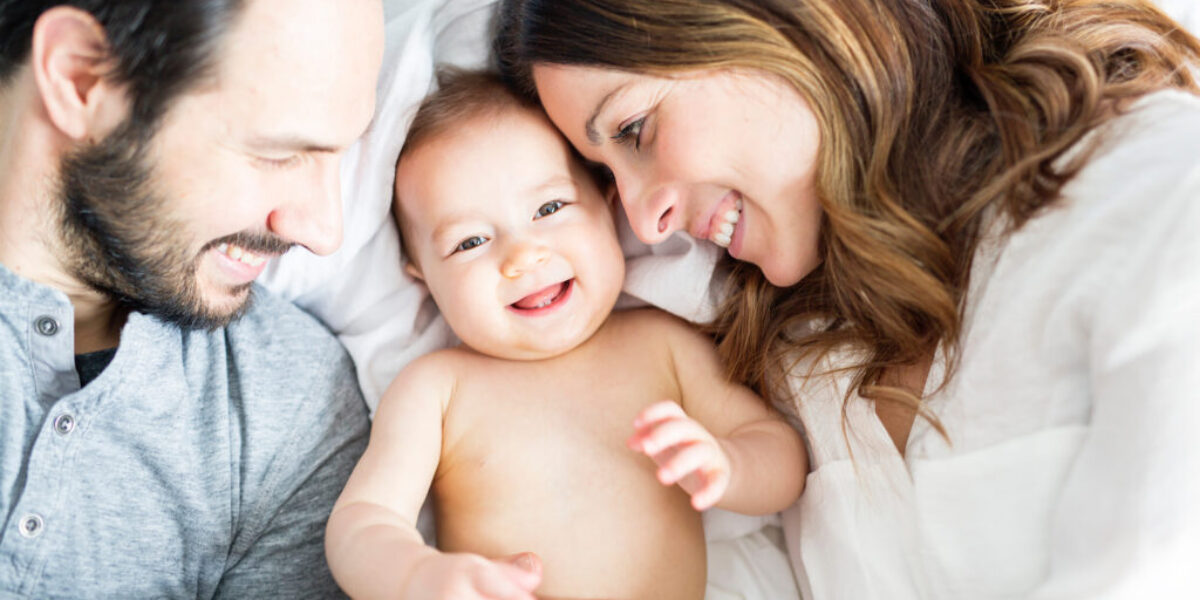 Young happy couple with baby