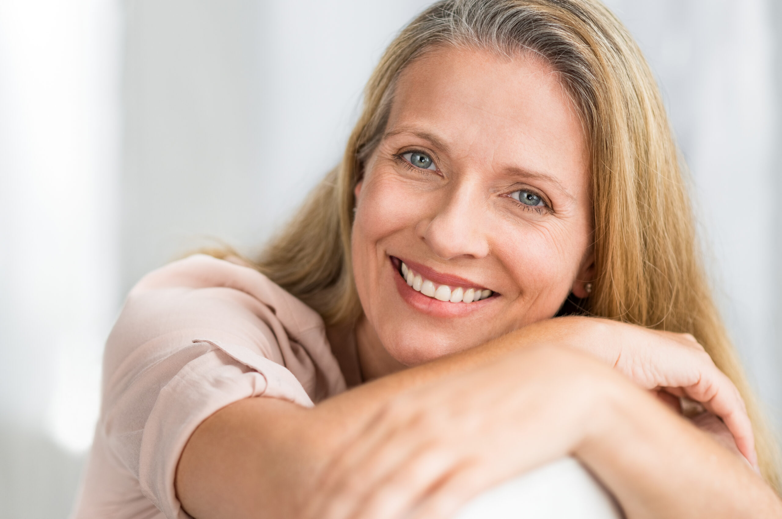 Smiling mature woman on couch
