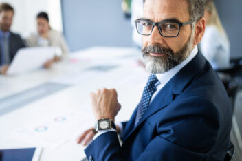 Middle aged business man in professional meeting