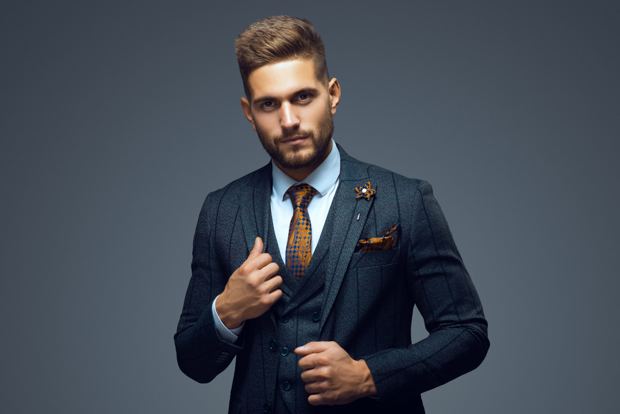Stylish young man in suit and tie. Business style. Fashionable i Stylish young business professional man