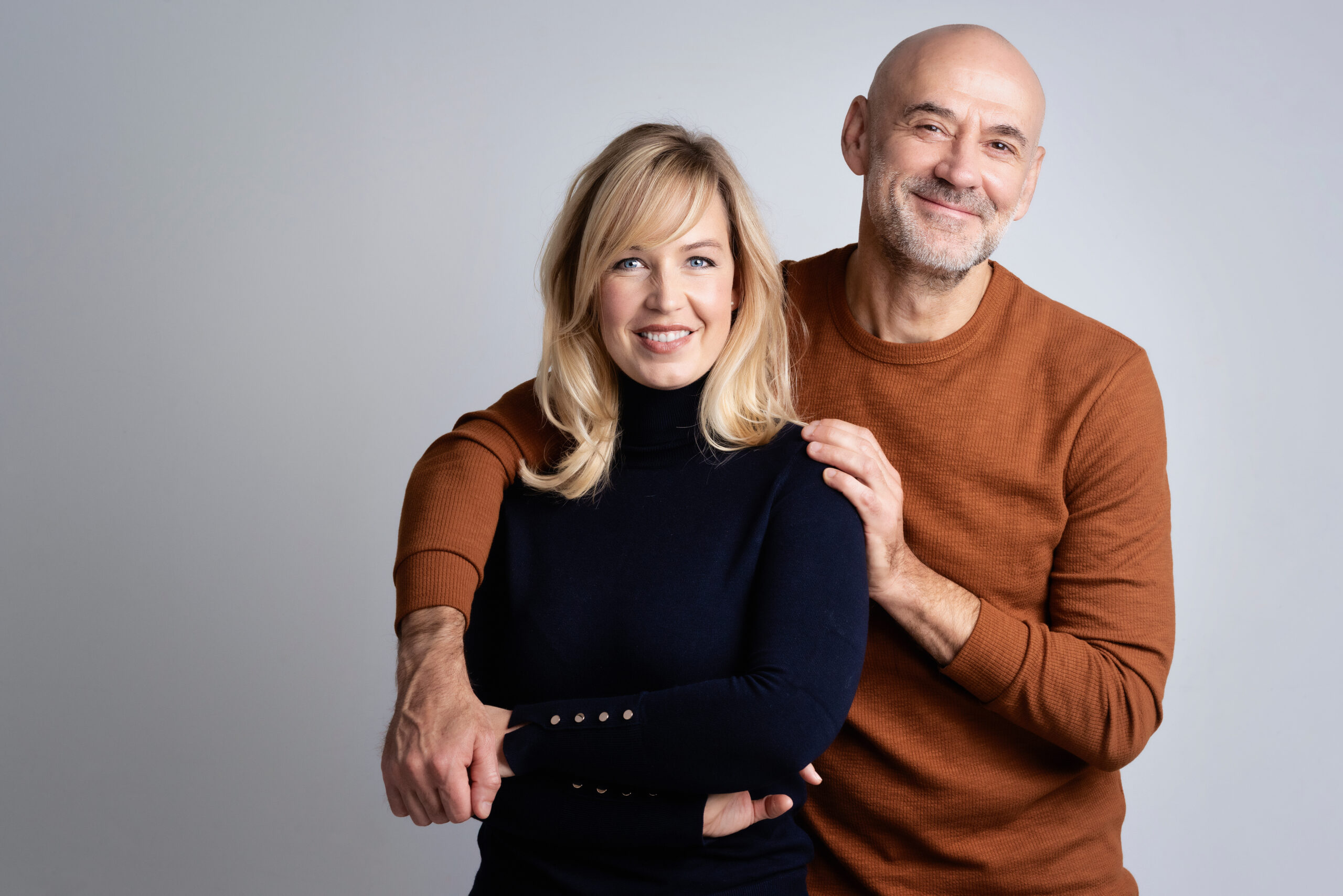 Happy mature couple studio portrait Wealthy couple thinking about strategies to reduce or eliminate estate taxes