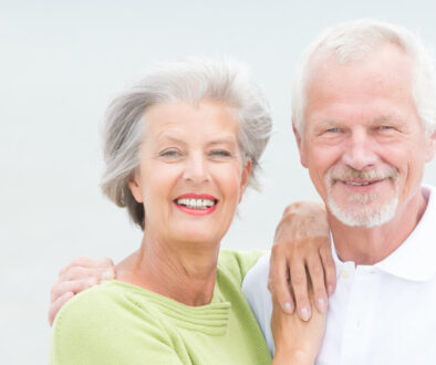 Older couple looking at camera with a big smile
