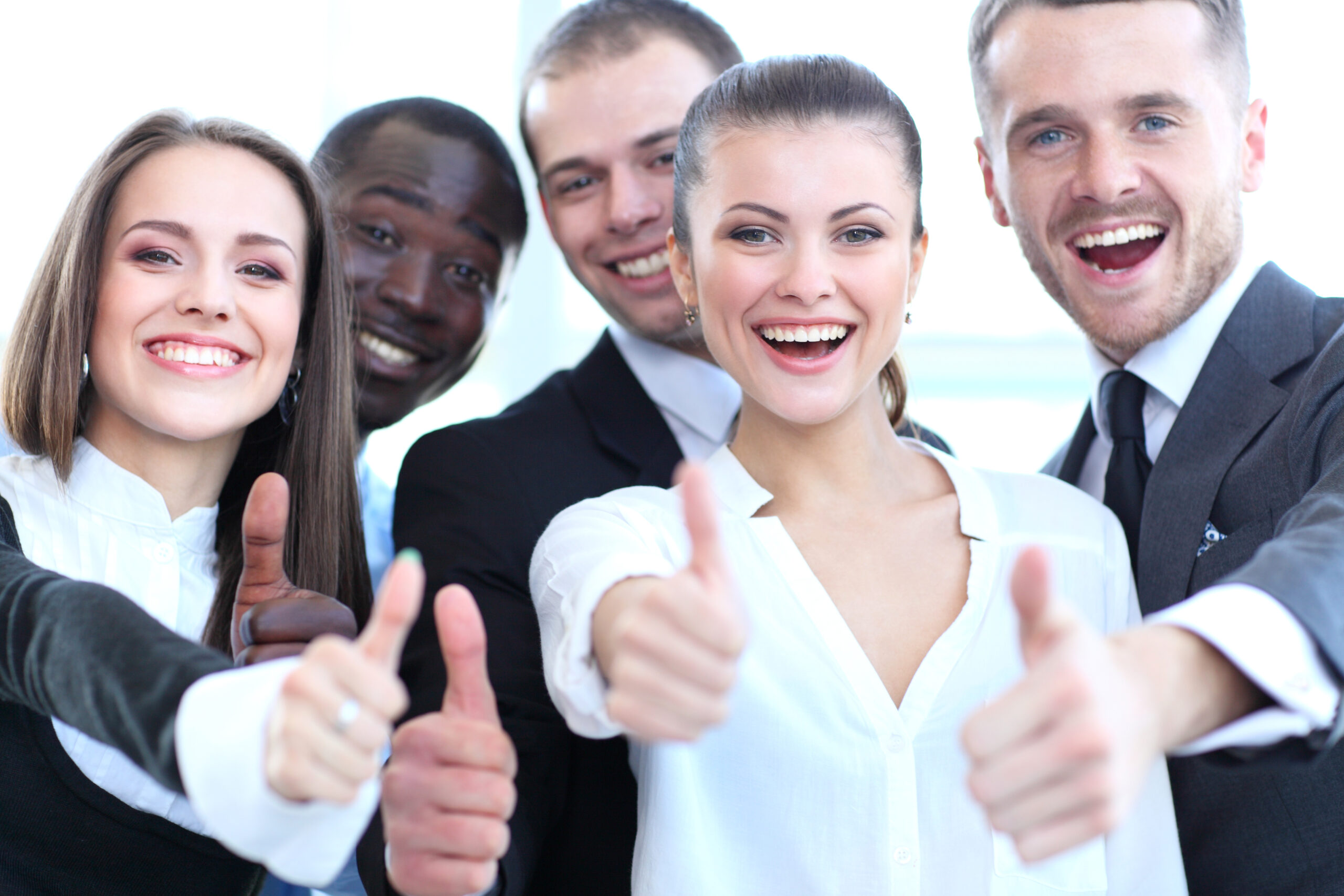 Group of Young Professionals Giving Thumbs Up