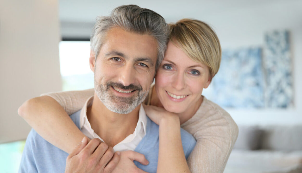 Middle aged couple buying long term care insurance