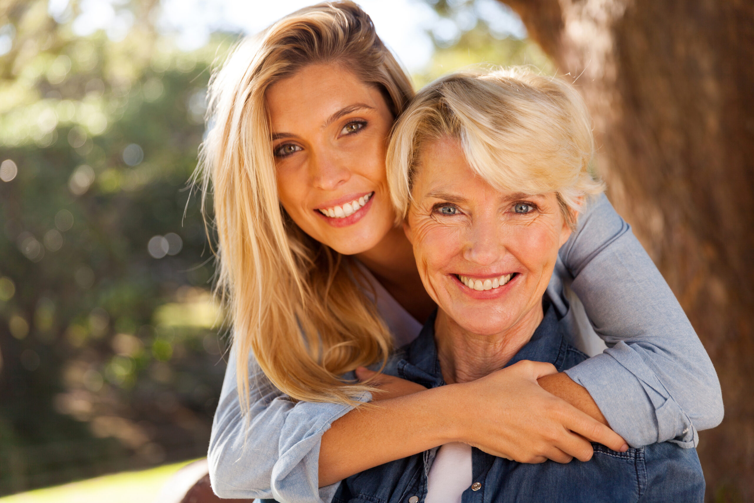 daughter hugging middle aged mother Mother and Daughter