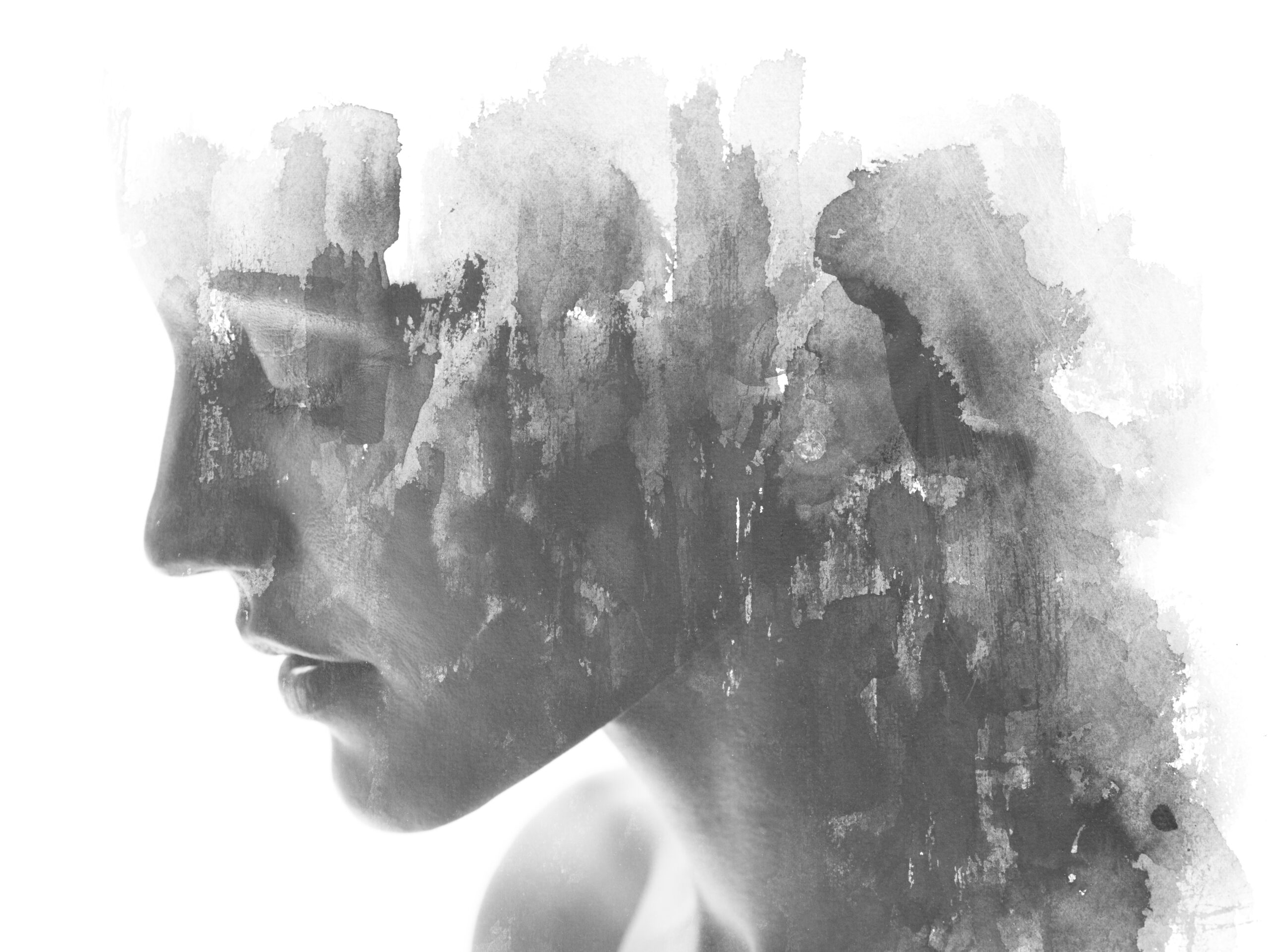 Paintography. Double exposure. Close up of an attractive model combined with hand drawn ink and watercolor painting with overlapping brushstroke texture, black and white Artistic rendering of a woman that suggests she is suffering from depression