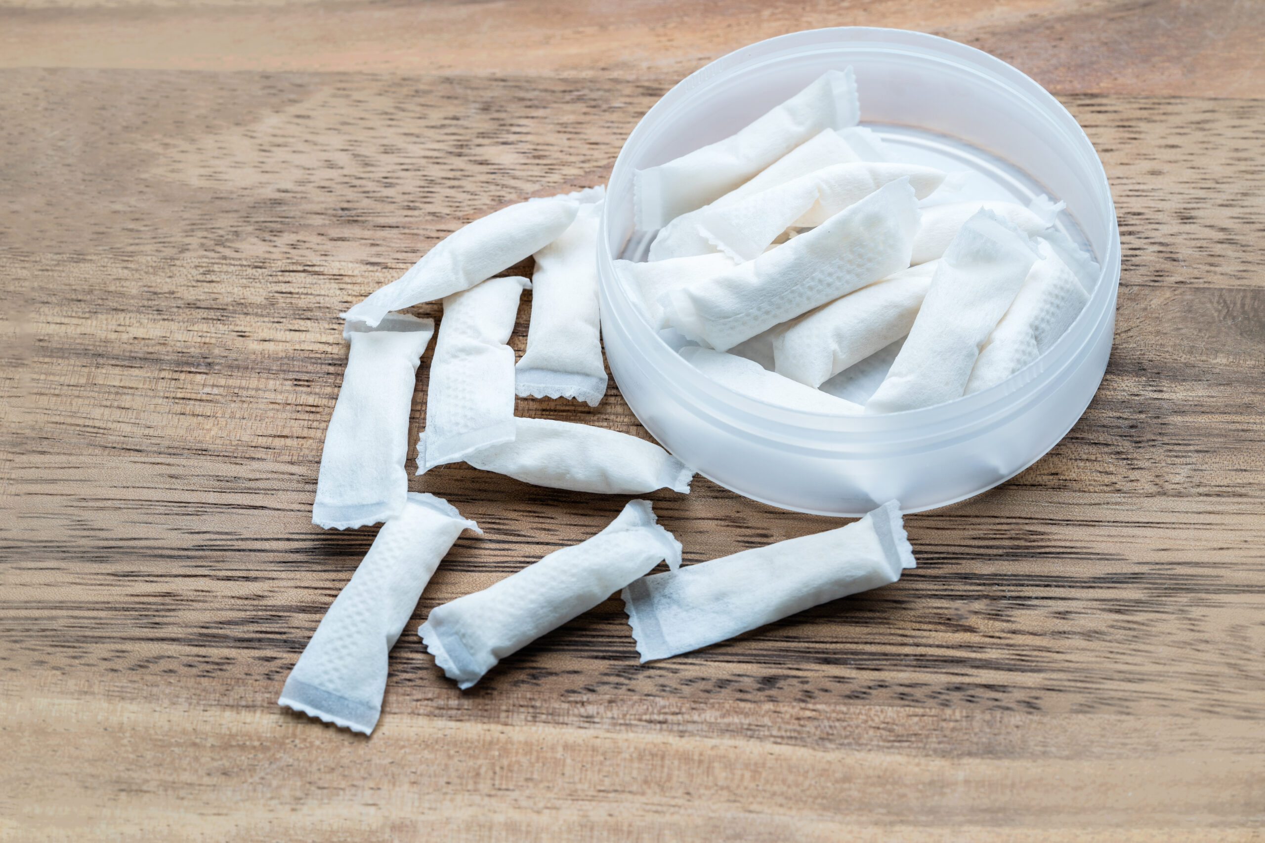 Box of swedish nicotine , snus on wood background Unlock Non-Tobacco Life Insurance Rates for ZYN Users – Cut Premiums in Half